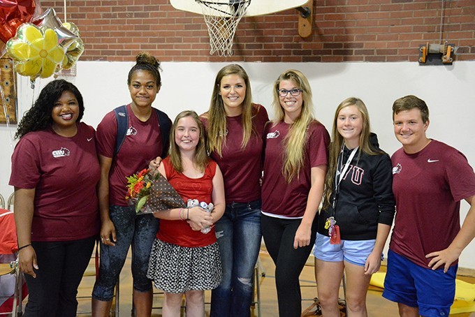 11-year-old Avory Clark, surrounded by members of CWI's women's rugby team,  has been diagnosed with Samter's Triad.